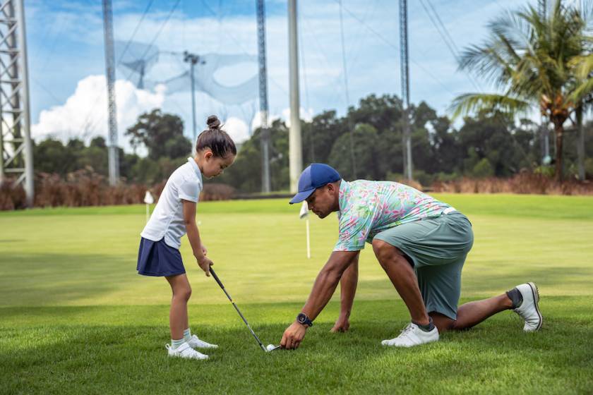 dad and daughter golfing