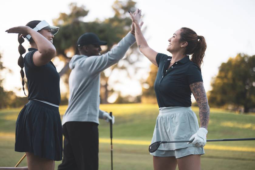 people high fiving while golfing in beaver creek